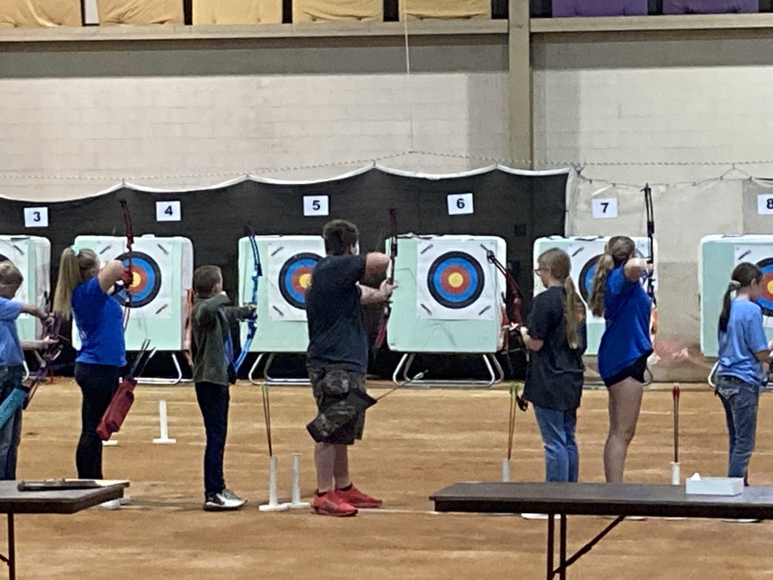 students competing in an archery competition