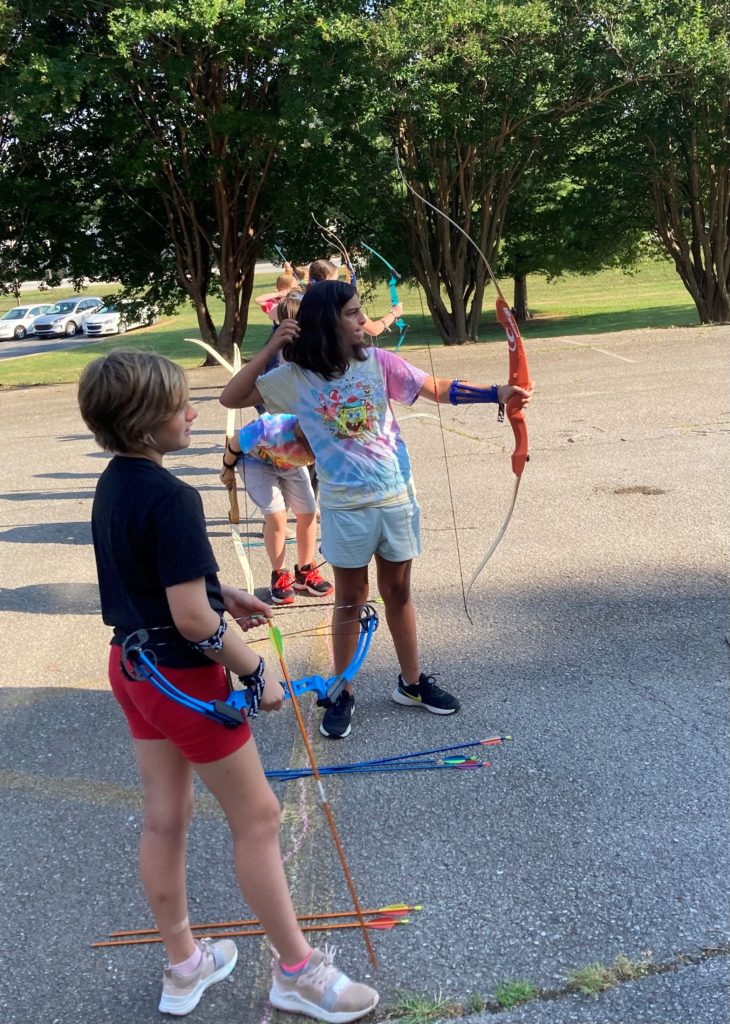 photo of a girl shooting a bow
