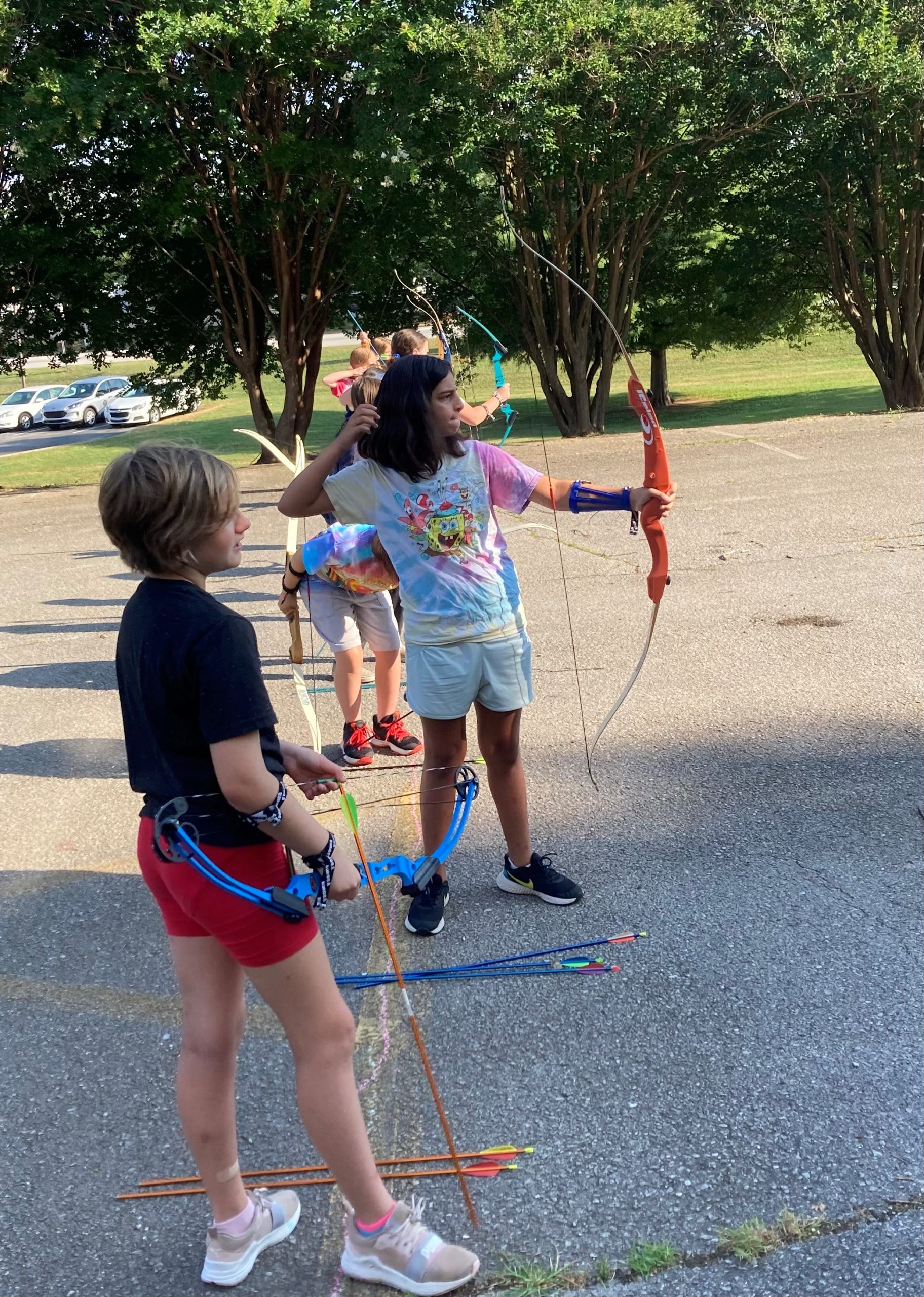 photo of a girl shooting a bow