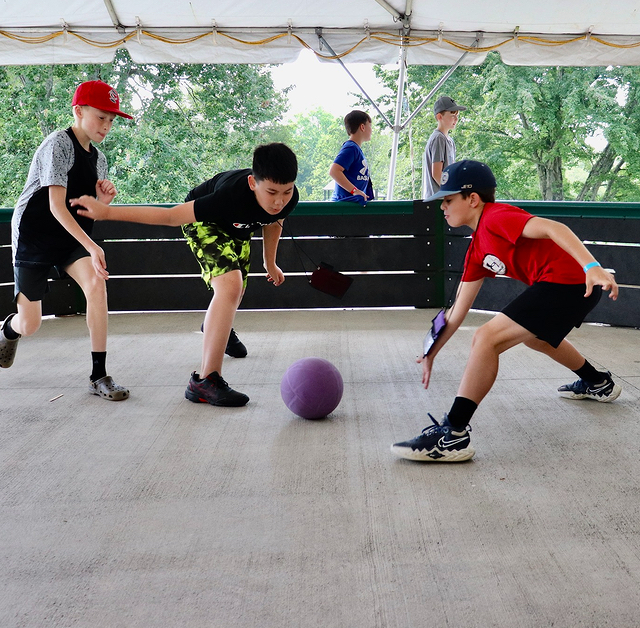 children playing a ball game at camp