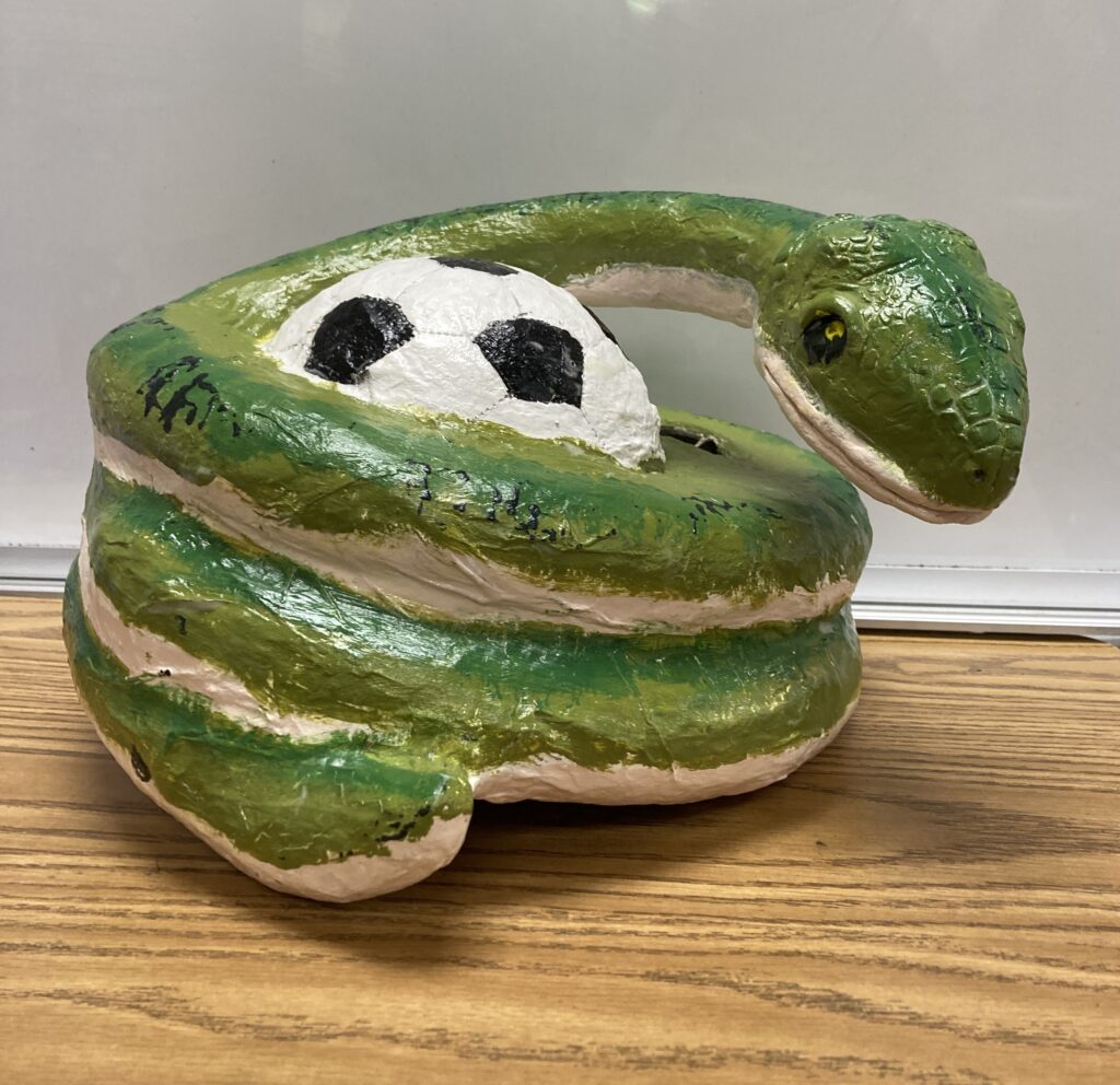 A piggy bank shaped like a snake