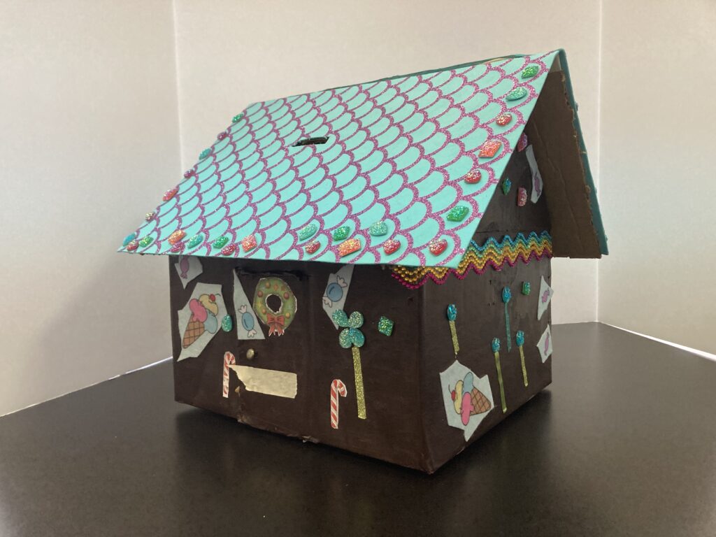 A piggy bank shaped like a house