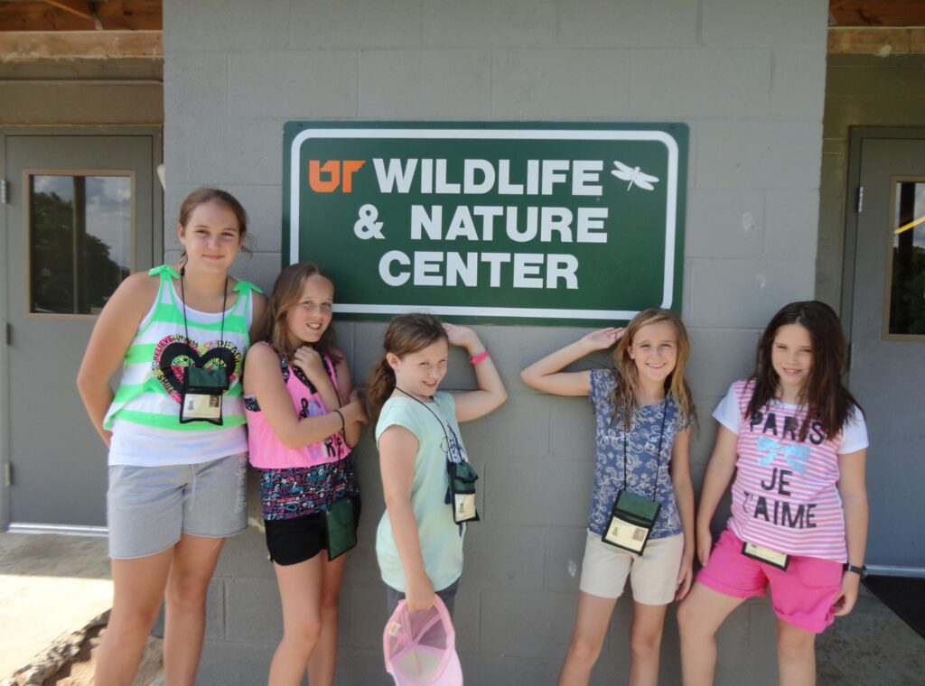 Children outside the camp wildlife center