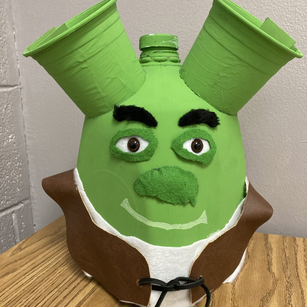 Photo of a piggy bank in the shape of a cartoon character Shrek, created for a 4-H contest