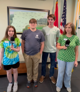 four teens pose for a photo